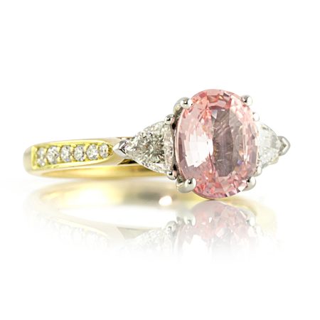 Peach-sapphire-trilliant-diamond-ring-bentley-de-lisle