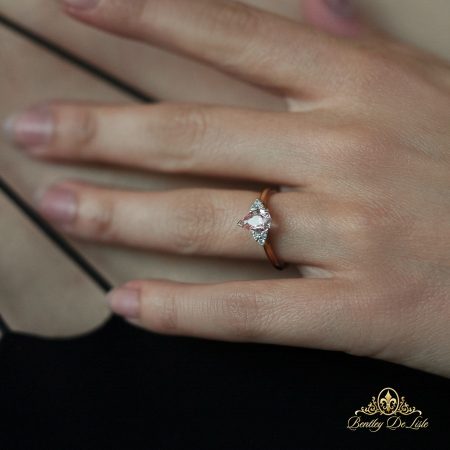 Pear-padparadscha-sapphire-diamond-ring-bentley-de-lisle-hand-model-2