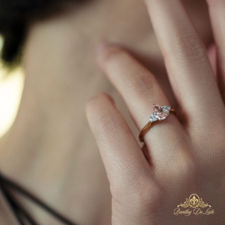 Pear-padparadscha-sapphire-diamond-ring-bentley-de-lisle-hand-model