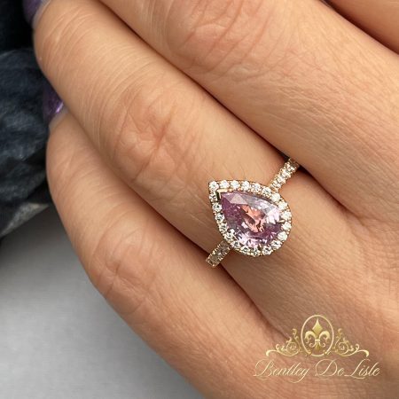 Pear-shape-padparadascha-sapphire-diamond-ring-bentley-de-lisle-hand