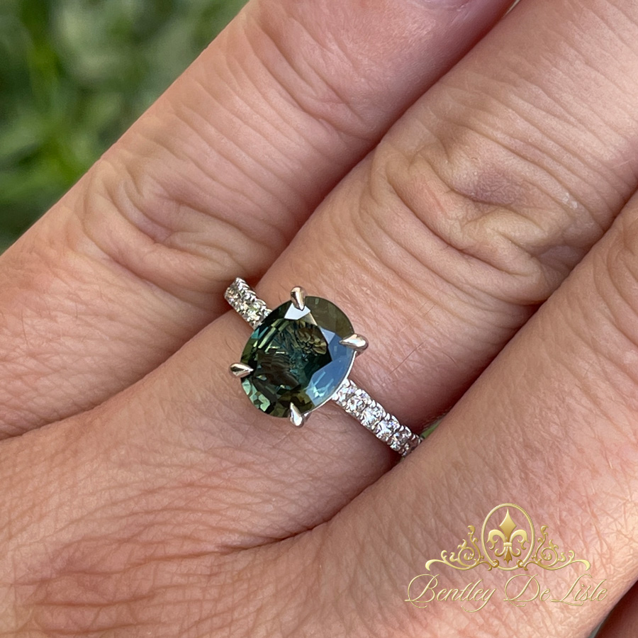 Oval-teal-green-sapphire-diamond-ring-bentley-de-lisle--10716-hand