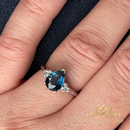 Blue-pear-sapphire-diamond-ring-bentley-de-lisle-11422-hand