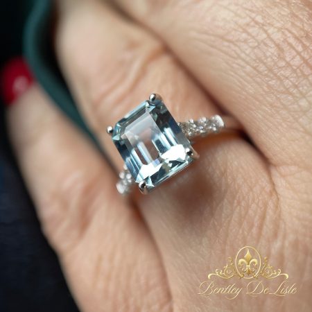 Emerald-cut-aquamarine-diamond-ring-bentley-de-lisle-hand