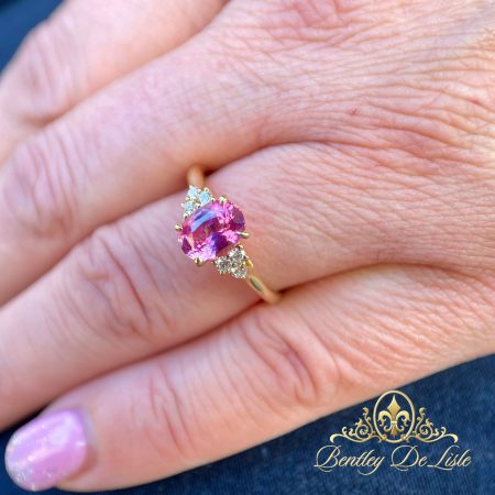 Intense-pink-sapphire-diamond-ring-bentley-de-lisle-hand
